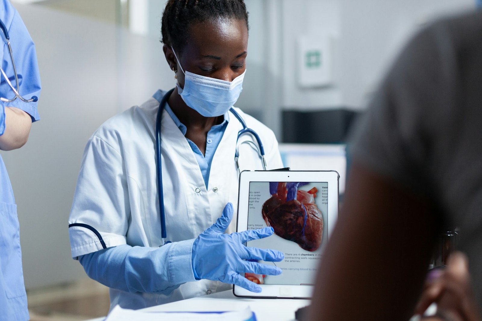 African american cardiologist doctor showing heart radiohraphy